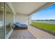 Outdoor patio overlooking a serene lake, perfect for relaxation and enjoying the waterfront view at 1607 Laurel Brook Ln, Port Charlotte, FL 33953