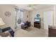Spare bedroom or office space with fan, TV and desk with natural light at 182 Rotonda W Blvd # B, Rotonda West, FL 33947