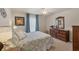 Cozy bedroom featuring a patterned bedspread and natural lighting at 182 Rotonda W Blvd # B, Rotonda West, FL 33947