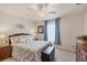 Inviting bedroom with natural light, fan, and matching wood furniture at 182 Rotonda W Blvd # B, Rotonda West, FL 33947