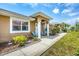 Inviting front entrance with a covered porch and seating area perfect for enjoying the outdoors at 182 Rotonda W Blvd # B, Rotonda West, FL 33947
