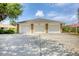 A spacious three-car garage provides ample parking and storage with curb appeal and design at 182 Rotonda W Blvd # B, Rotonda West, FL 33947