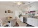 An open kitchen with a breakfast nook and bar top overlooking the dining room at 182 Rotonda W Blvd # B, Rotonda West, FL 33947