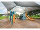 Well-equipped community playground featuring climbing structures and a slide at 182 Rotonda W Blvd # B, Rotonda West, FL 33947