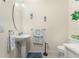Neutral-toned powder room featuring a pedestal sink and coastal decor accents at 20231 Lagente Cir, Venice, FL 34293