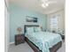 Relaxing bedroom with aqua walls, a queen-sized bed, and coastal-themed decor creating a serene atmosphere at 20231 Lagente Cir, Venice, FL 34293