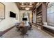 Conference room featuring a large table with chairs, a bookcase, and TV screens at 20231 Lagente Cir, Venice, FL 34293