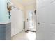 Foyer featuring tile floors, a glass front door, and a white closet at 20231 Lagente Cir, Venice, FL 34293