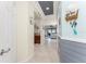 Spacious hallway with tile flooring that leads to the kitchen and living area at 20231 Lagente Cir, Venice, FL 34293