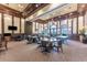 Community game room featuring tables, chairs, and pool tables for residents' entertainment at 20231 Lagente Cir, Venice, FL 34293
