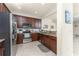 Kitchen with stainless steel appliances, granite countertops, and tile backsplash at 20231 Lagente Cir, Venice, FL 34293