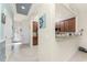 Open kitchen with granite counters, stainless appliances, and view into living room at 20231 Lagente Cir, Venice, FL 34293