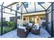 Screened lanai featuring a seating area perfect for enjoying outdoor living at 20231 Lagente Cir, Venice, FL 34293