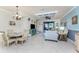 Open concept home featuring a living room, dining area, and coastal decor throughout at 20231 Lagente Cir, Venice, FL 34293