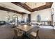Large meeting room featuring neutral walls, arched windows, tables and chairs for gatherings at 20231 Lagente Cir, Venice, FL 34293