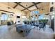 Open air recreation room with fireplace, seating area, and ping pong table, perfect for socializing at 20231 Lagente Cir, Venice, FL 34293