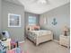 Bedroom with nautical decor, including an anchor and sea-themed artwork at 20279 Lagente Cir, Venice, FL 34293