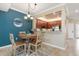 Charming dining area showcasing a round table with seating for four, complemented by stylish decor and cozy ambiance at 20279 Lagente Cir, Venice, FL 34293