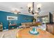 Inviting living room featuring comfortable leather seating, coastal decor, and access to outdoor views, ideal for relaxation at 20279 Lagente Cir, Venice, FL 34293