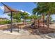 Community playground with various play structures, benches, and shaded areas for children at 20279 Lagente Cir, Venice, FL 34293