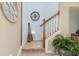 Staircase with white railing, coastal decor, and a Venice Beach sign at 20279 Lagente Cir, Venice, FL 34293