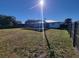 Spacious backyard with a pool and a high privacy fence at 2259 Lee Ter, Port Charlotte, FL 33952