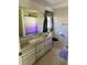 Bathroom featuring a double sink vanity and shower/tub combo at 2259 Lee Ter, Port Charlotte, FL 33952