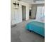 Bedroom showcasing a ceiling fan, natural light, carpeted floors, and access to the kitchen at 2259 Lee Ter, Port Charlotte, FL 33952