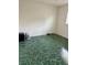 Empty bedroom featuring large window and green-marbled flooring at 2259 Lee Ter, Port Charlotte, FL 33952