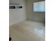 Bedroom featuring a large window, built-in shelving and tile flooring at 2259 Lee Ter, Port Charlotte, FL 33952