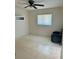 Bedroom featuring a large window, built-in shelving and tile flooring at 2259 Lee Ter, Port Charlotte, FL 33952