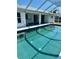 Inviting in-ground pool enclosed with screen; an outdoor oasis for relaxation and fun at 2259 Lee Ter, Port Charlotte, FL 33952