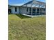 A refreshing screened pool with a well-maintained backyard for outdoor enjoyment at 2259 Lee Ter, Port Charlotte, FL 33952