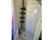 Shower stall featuring white tile and a mounted organizer at 2259 Lee Ter, Port Charlotte, FL 33952