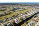 Aerial view of home on canal with golf course in the neighborhood at 235 Caddy Rd, Rotonda West, FL 33947