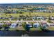 Aerial view of homes on canal with golf course neighborhood at 235 Caddy Rd, Rotonda West, FL 33947