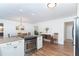 Spacious open kitchen featuring an oven and a view of the dining area and living room at 235 Caddy Rd, Rotonda West, FL 33947