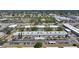 An aerial shot showcasing the entire property, including buildings, pool, and parking areas at 2437 Harbor Blvd # 204, Port Charlotte, FL 33952