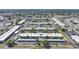 This aerial shows a desirable condo community featuring mature trees, assigned parking, and well-maintained landscaping at 2437 Harbor Blvd # 204, Port Charlotte, FL 33952