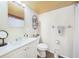 Bathroom featuring a white vanity, framed mirror, and updated fixtures at 2437 Harbor Blvd # 204, Port Charlotte, FL 33952