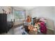 Bedroom with a large window and wood floors at 2437 Harbor Blvd # 204, Port Charlotte, FL 33952