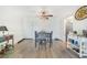 An ample sized dining room featuring a ceiling fan and plank flooring at 2437 Harbor Blvd # 204, Port Charlotte, FL 33952