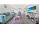 Inviting living room featuring comfortable seating, a plank floor and natural light at 2437 Harbor Blvd # 204, Port Charlotte, FL 33952