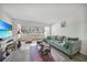 Relaxing living room with a cozy couch and a large window that brings in natural light and creates an open feel at 2437 Harbor Blvd # 204, Port Charlotte, FL 33952