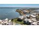 Stunning aerial view of waterfront condos with boat docks, pool, and manicured grounds, perfect for coastal living at 2955 N Beach Rd # D123, Englewood, FL 34223