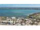 Aerial view of condos, lush landscaping, and serene water views at 2955 N Beach Rd # D123, Englewood, FL 34223