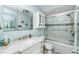 Well-maintained bathroom features a vanity with marble countertop and a tiled shower and bathtub combination at 2955 N Beach Rd # D123, Englewood, FL 34223