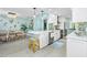 Open concept kitchen with breakfast bar, sleek appliances, and a bright, airy feel at 2955 N Beach Rd # D123, Englewood, FL 34223