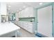 Lovely white kitchen with white countertops, ample storage, and stainless steel appliances at 2955 N Beach Rd # D123, Englewood, FL 34223