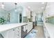 Updated kitchen with stainless steel appliances, white cabinets, and plenty of counter space at 2955 N Beach Rd # D123, Englewood, FL 34223
